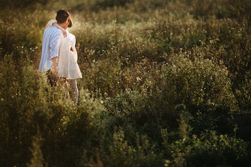 Couple Kissing Surrounded With Plants