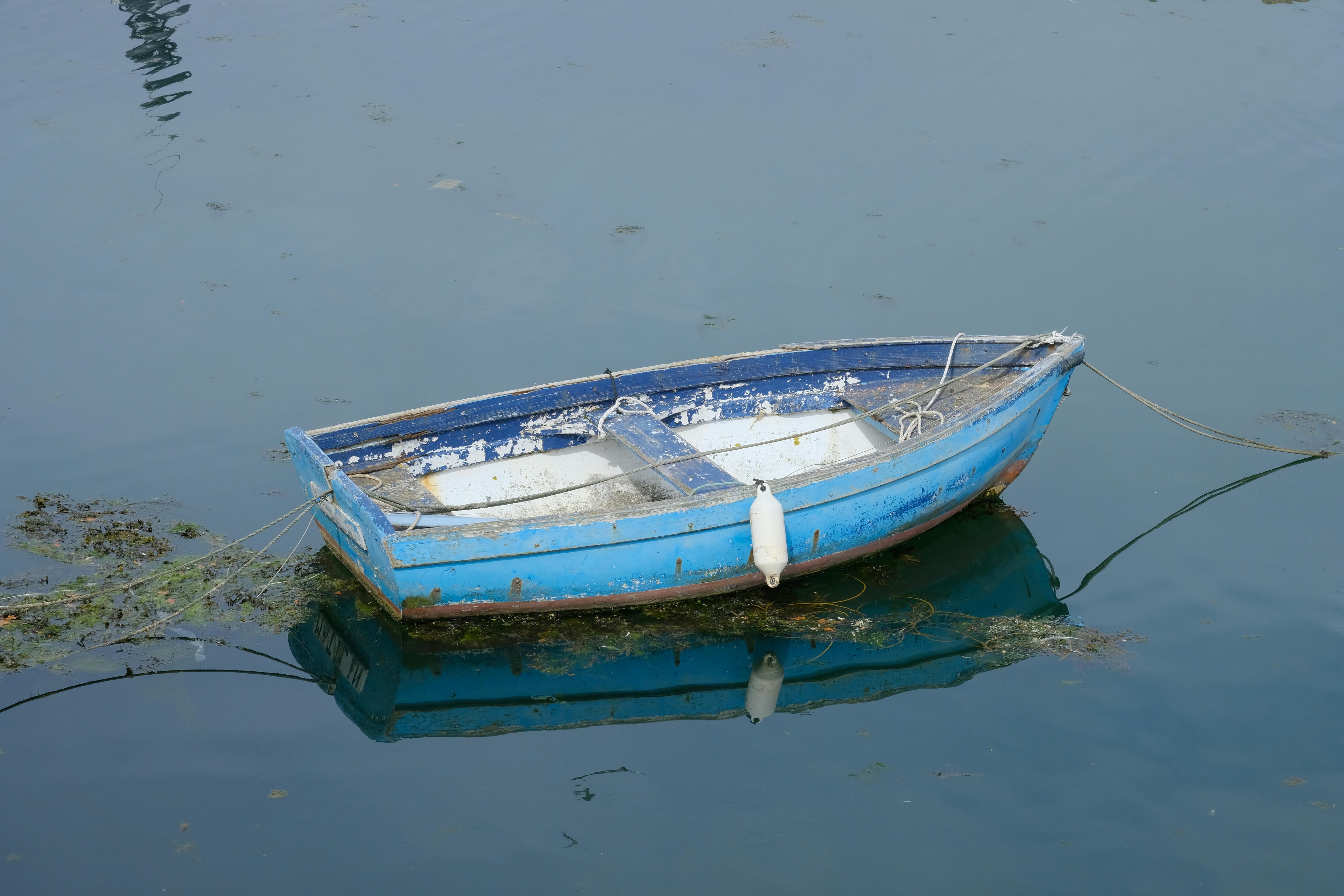 Small Wooden Boat On The Calm Lake Stock Photo, Picture and