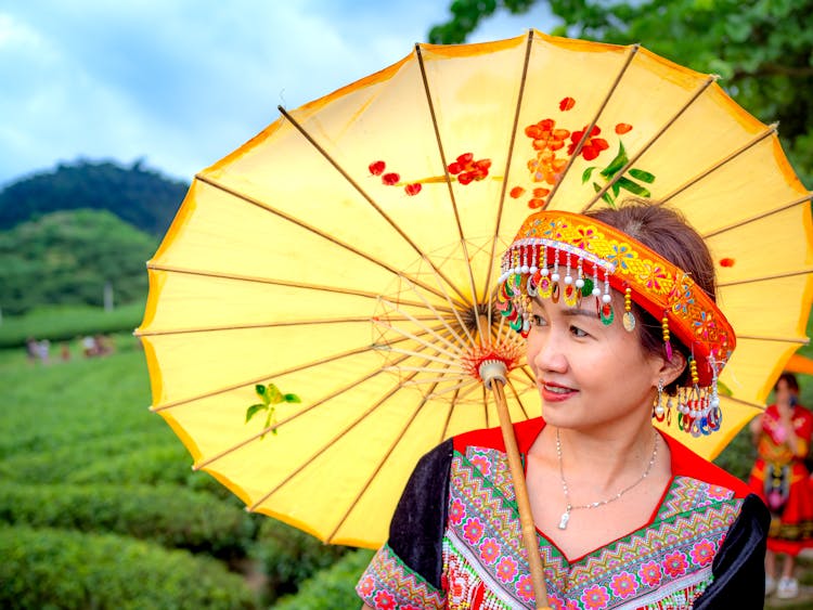 A Woman Using An Umbrella