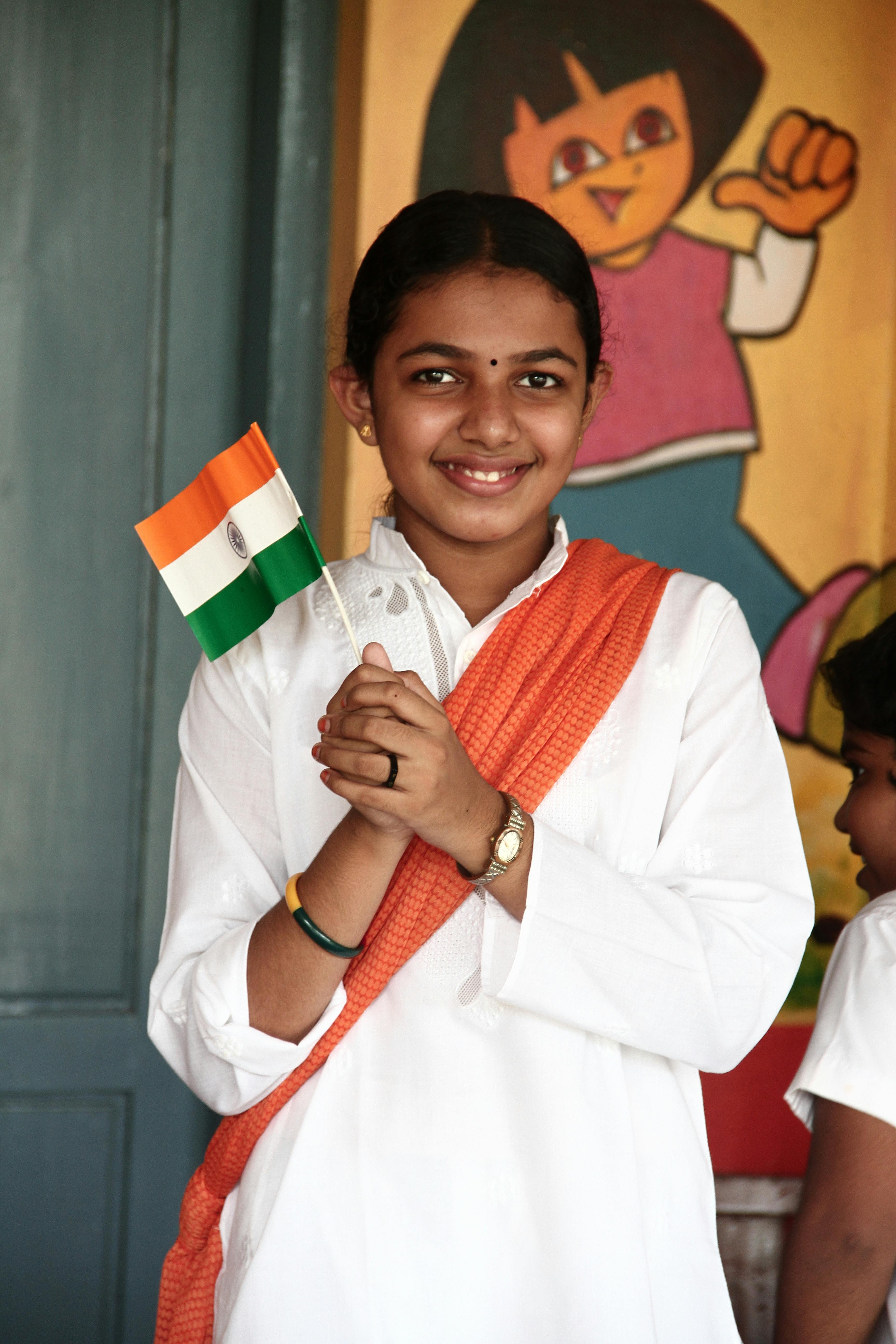 A Woman Holding an Indian Flaglet · Free Stock Photo