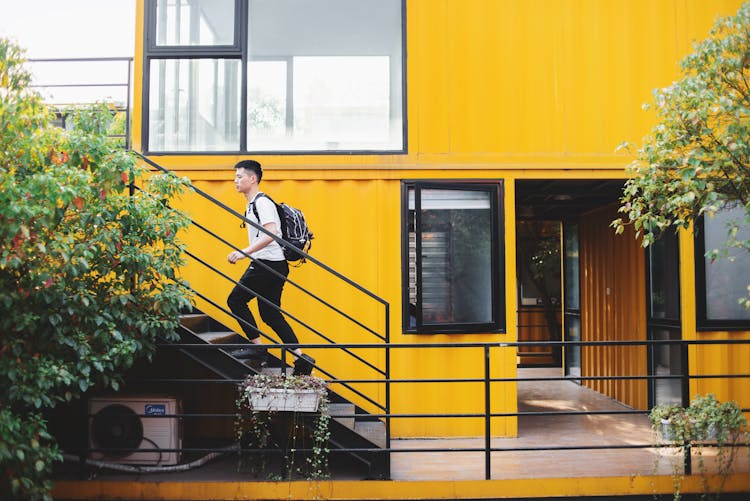 A Man Walking Up The Stairs