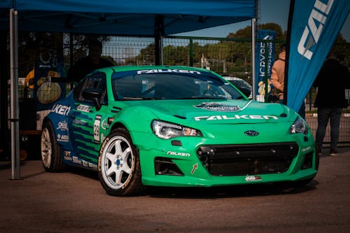 Green Racing Car Parked on the Street