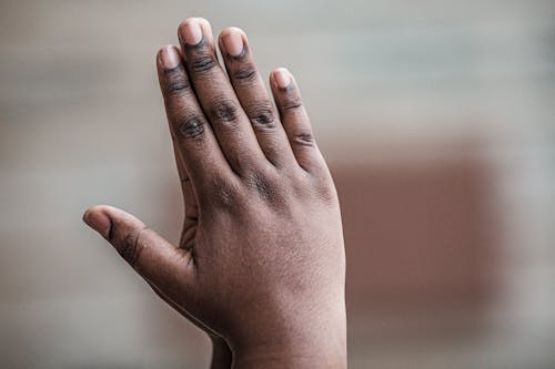 Hands Praying in Close-up Photography