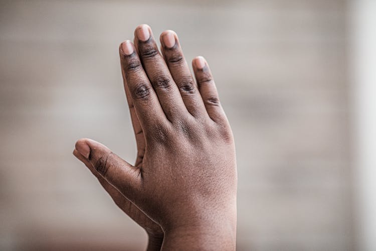 A Hand Touching A Mirror 