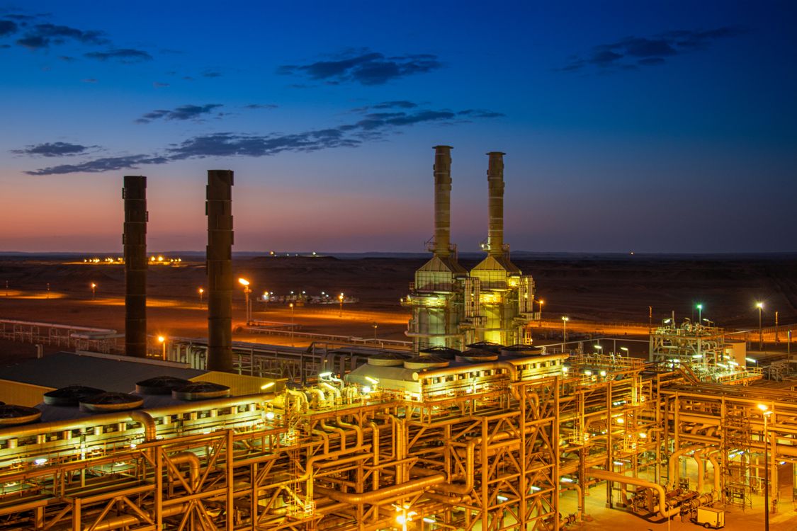 Illuminated Factory at Sunset · Free Stock Photo