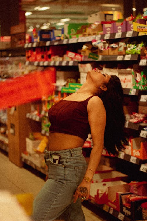 Woman Dancing in Supermarket