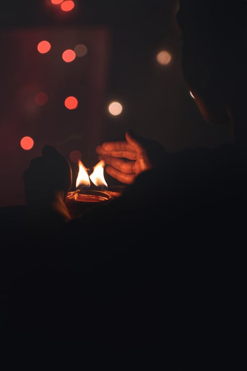 Man Hands over Candles