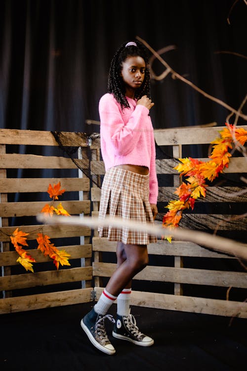 Teenager Girl Posing in Autumn Decorations