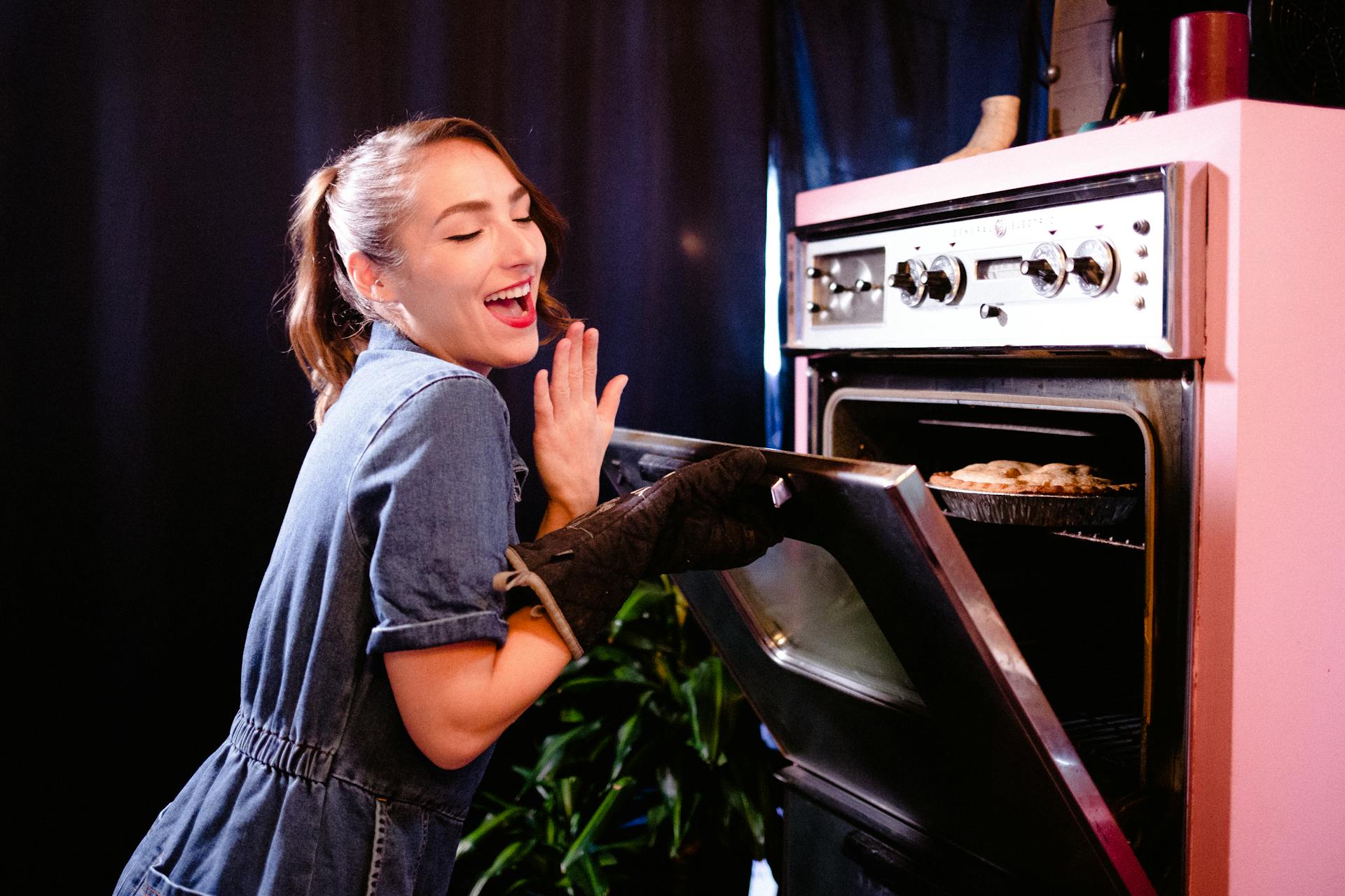 Smiling Woman Baking in Retro Kitchen