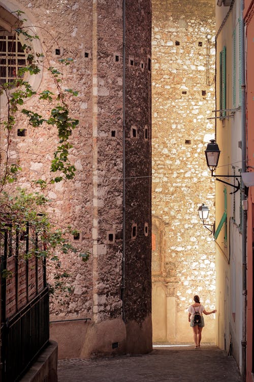 A Woman Walking Down the Alley