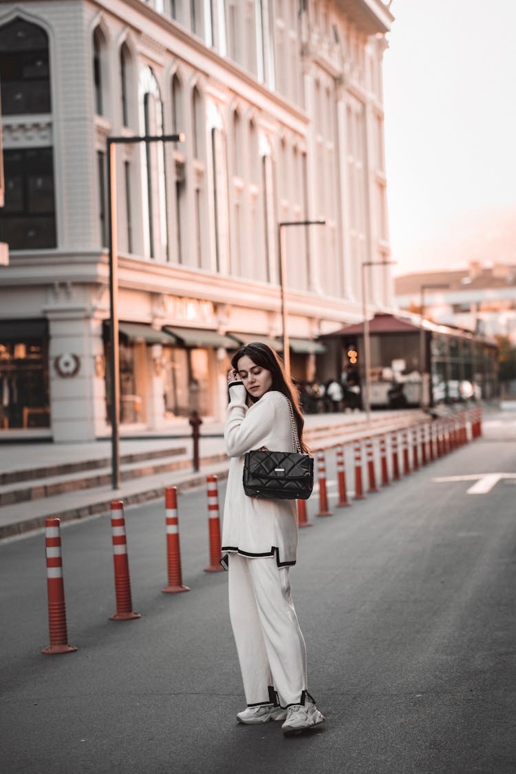 Woman Posing On Empty Street