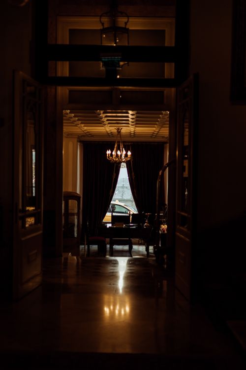 Free Warm lighting and an antique chandelier enhance this elegant İstanbul dining room interior. Stock Photo