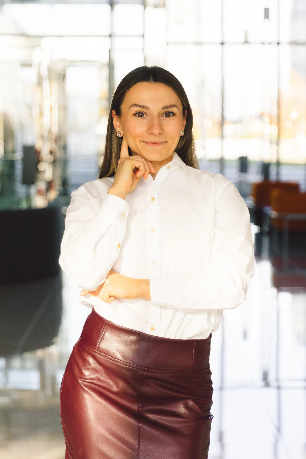 Same woman in white shirt, smiling
