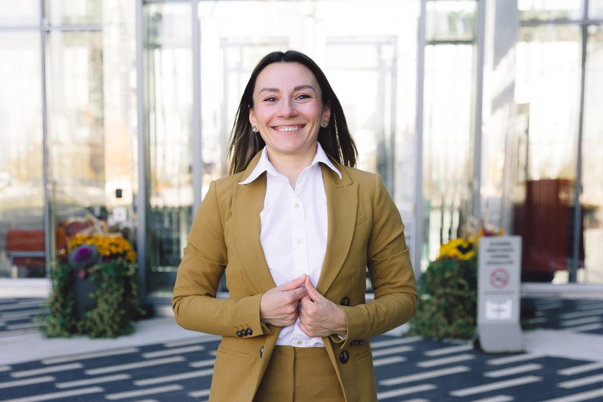 Woman in a blazer smiling