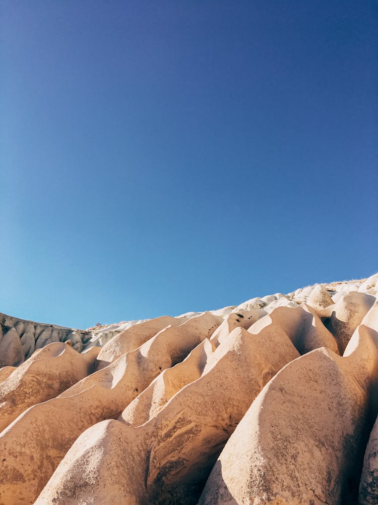 Brown Rock Formation Under Blue Sky