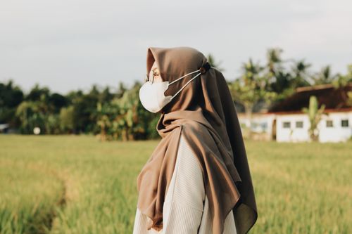 Free a girl in the middle of the field Stock Photo