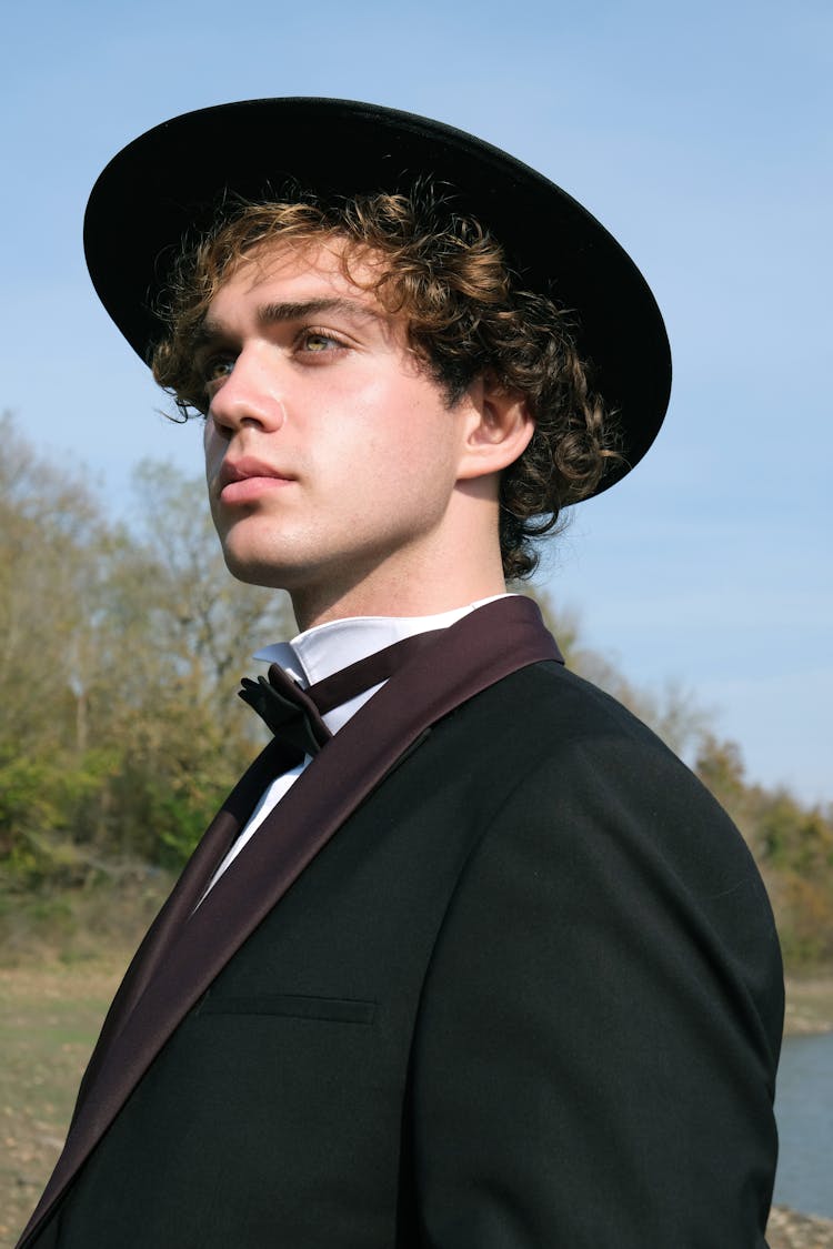 Man In Tuxedo Wearing Black Hat