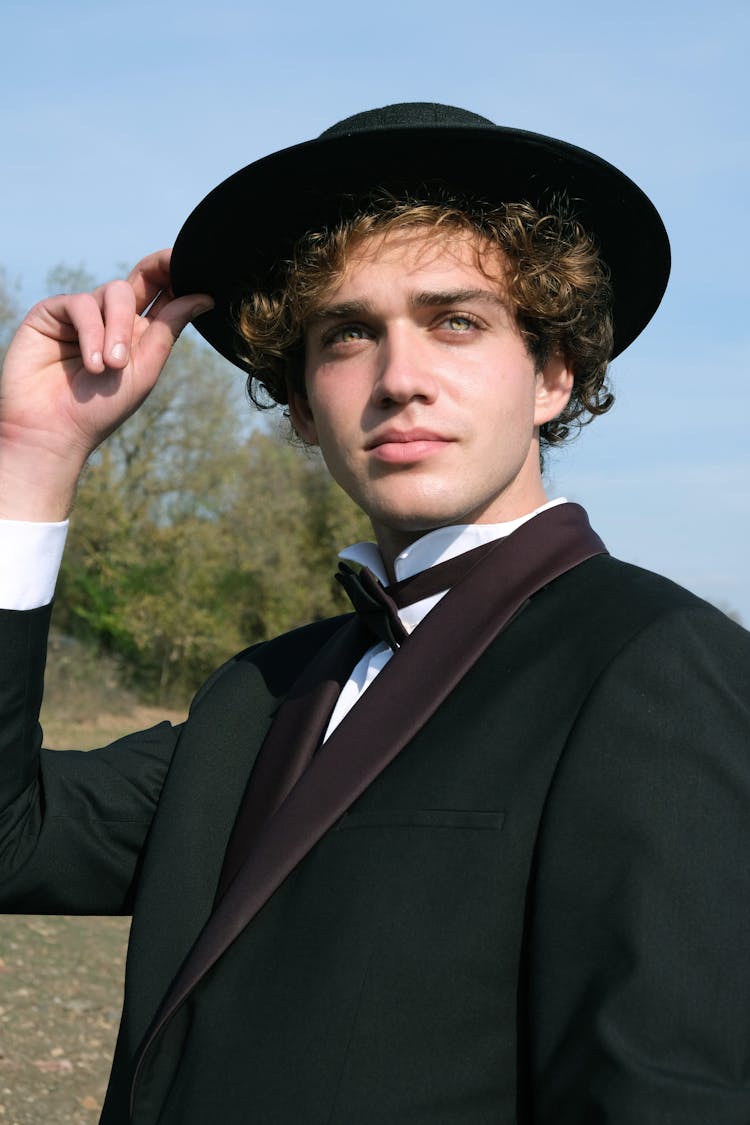 Man In Black Hat Wearing A Tuxedo