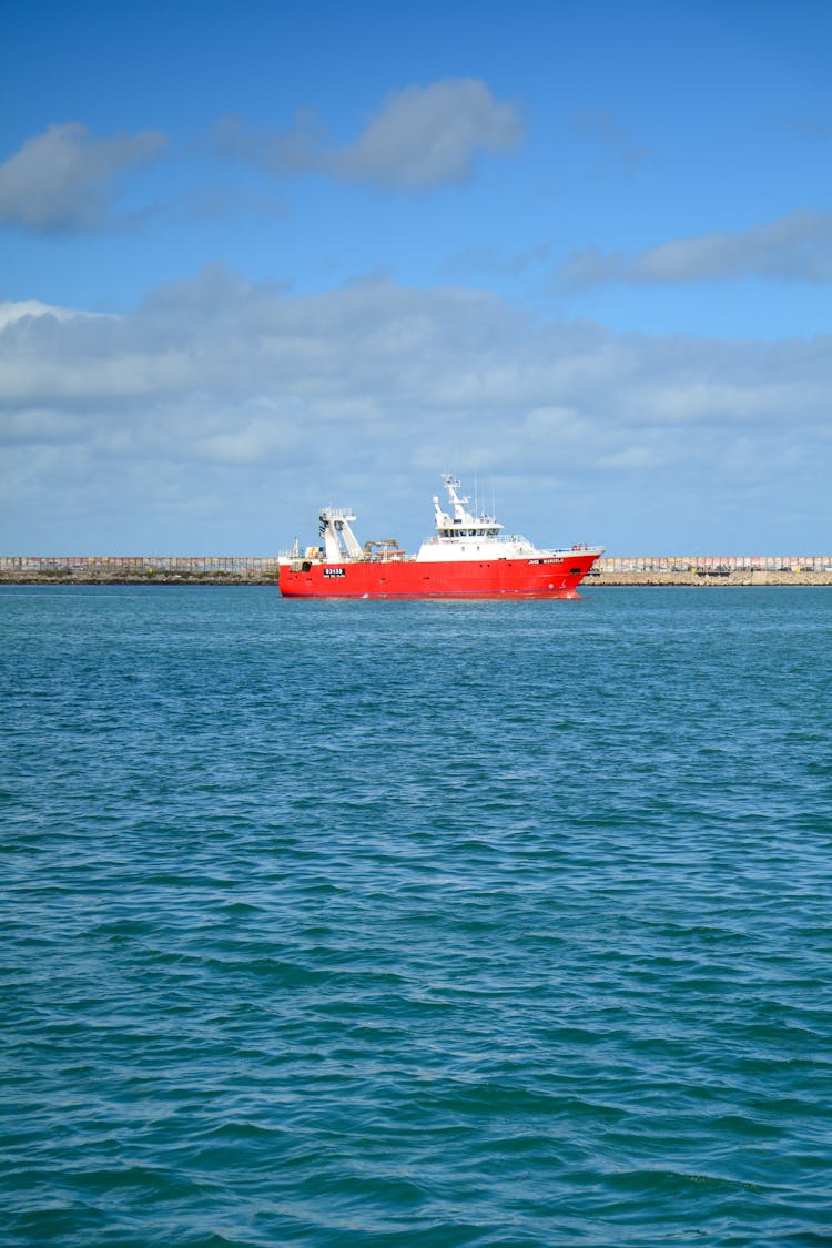 Red And White Ship On Water