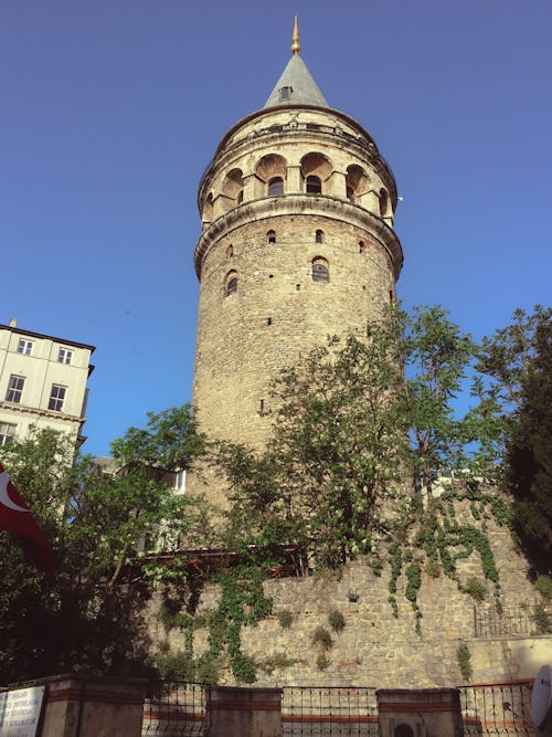 A Low Angle Shot of Galata Tower Under the Blue Sky