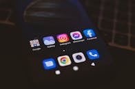 A Close-up Shot of a Mobile Phone with Applications on Screen