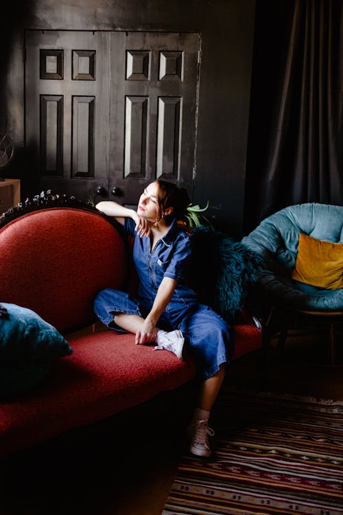 Woman Posing on Armchair in Room