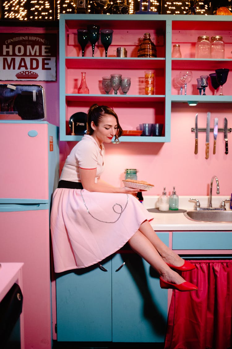 Woman In Dress Posing On Retro Kitchen