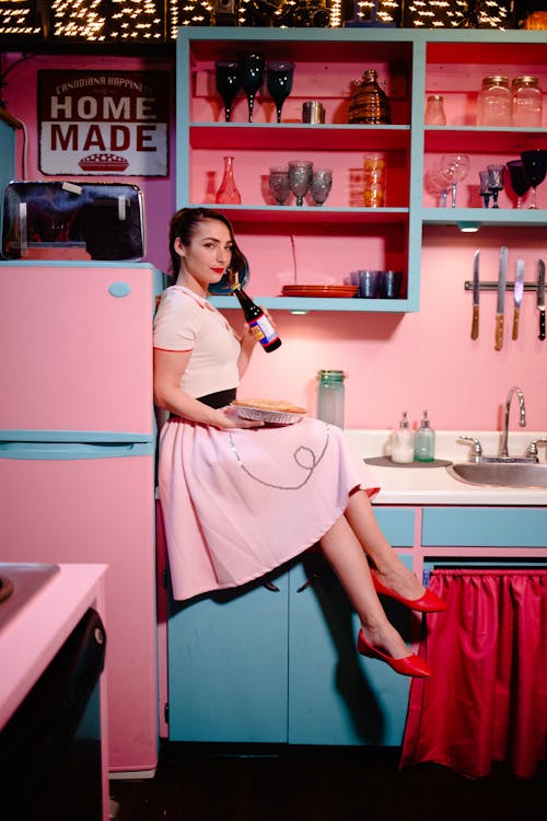 A Woman Sitting on the Counter Top