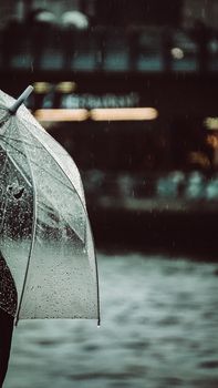 A transparent umbrella in the rain along the waterfront in Istanbul, Turkey.