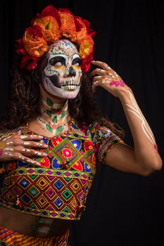 Woman in Yellow Green and Red Floral Dress With Red and Yellow Face Paint