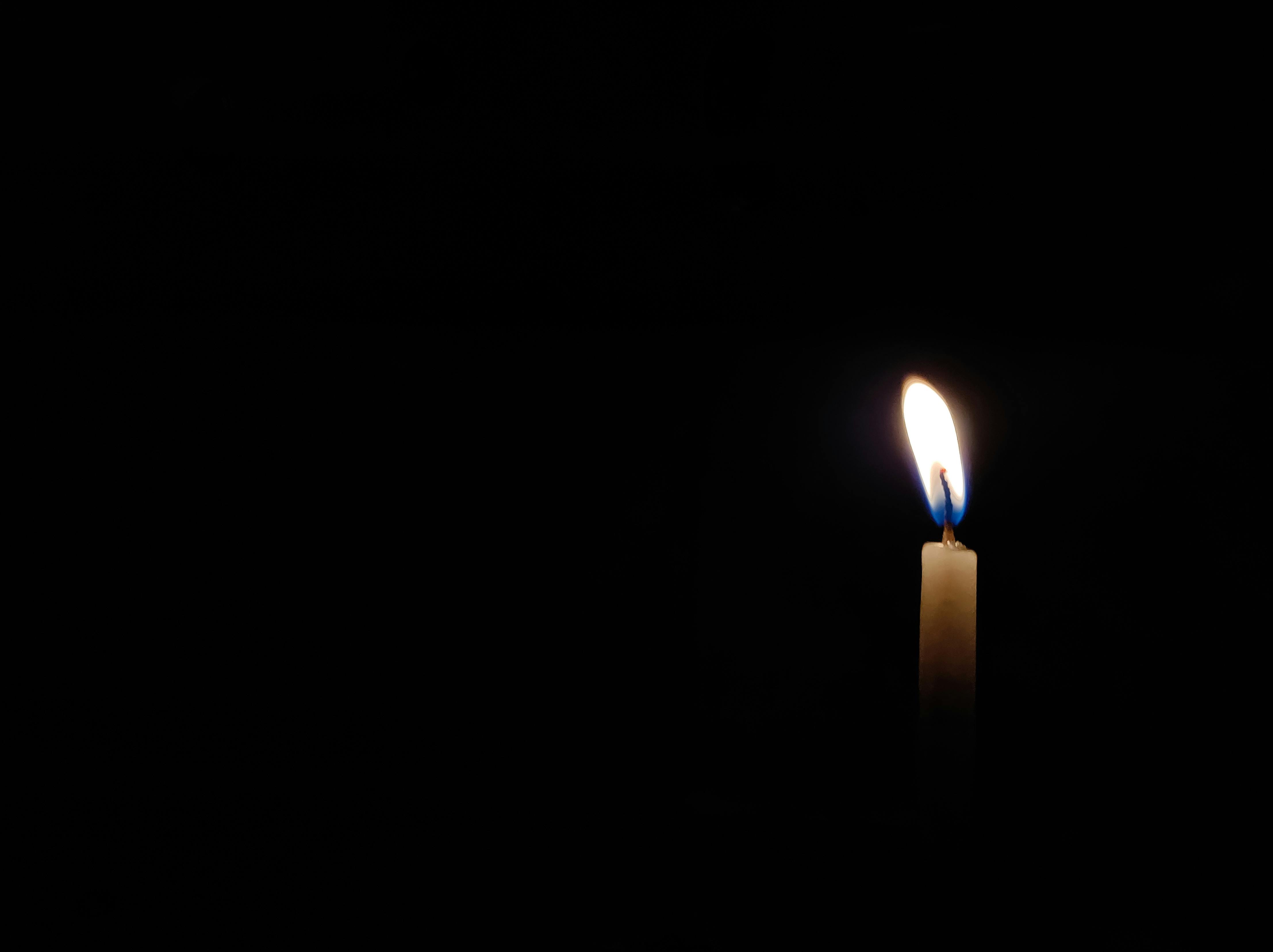 CloseUp Photo of Lighted Candle ·
