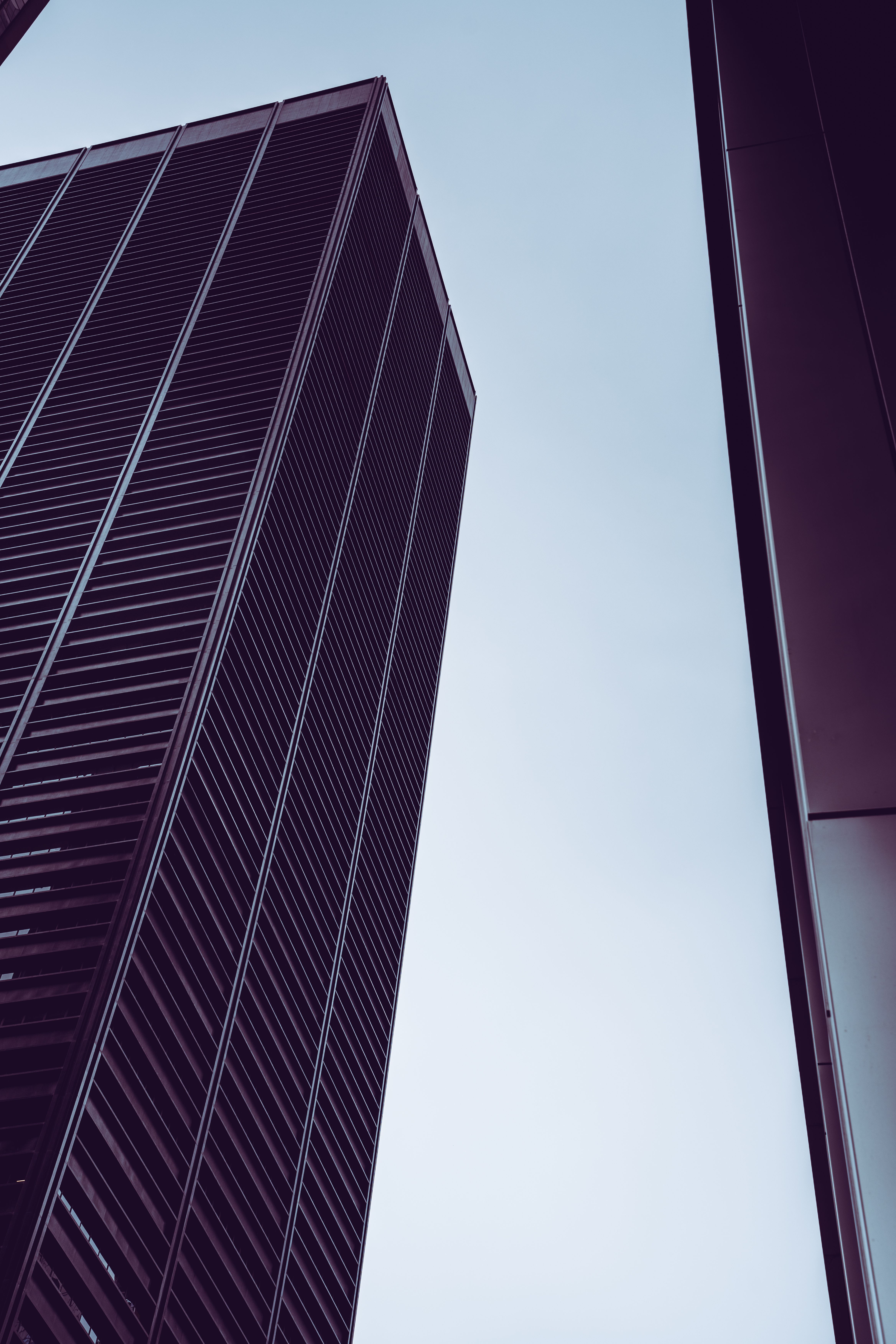 A Low Angle Shot of a Building Under the Clear Sky · Free Stock Photo
