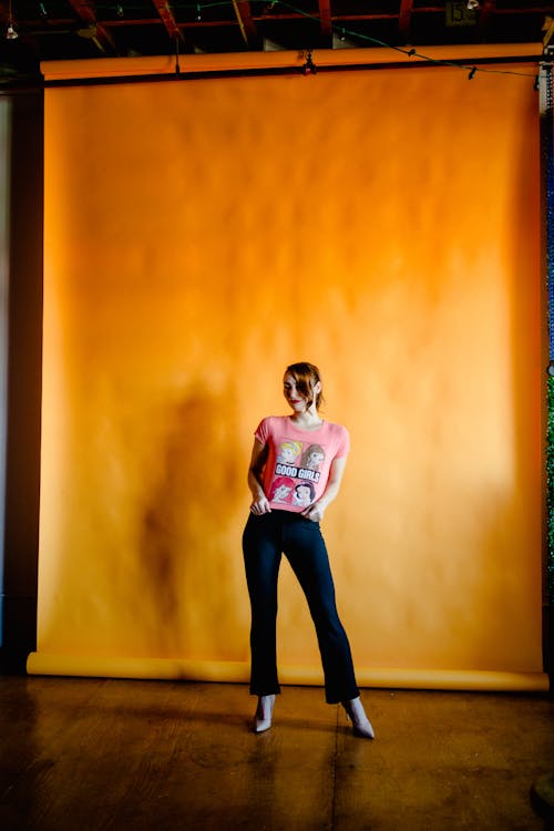 Woman Posing on Yellow Background