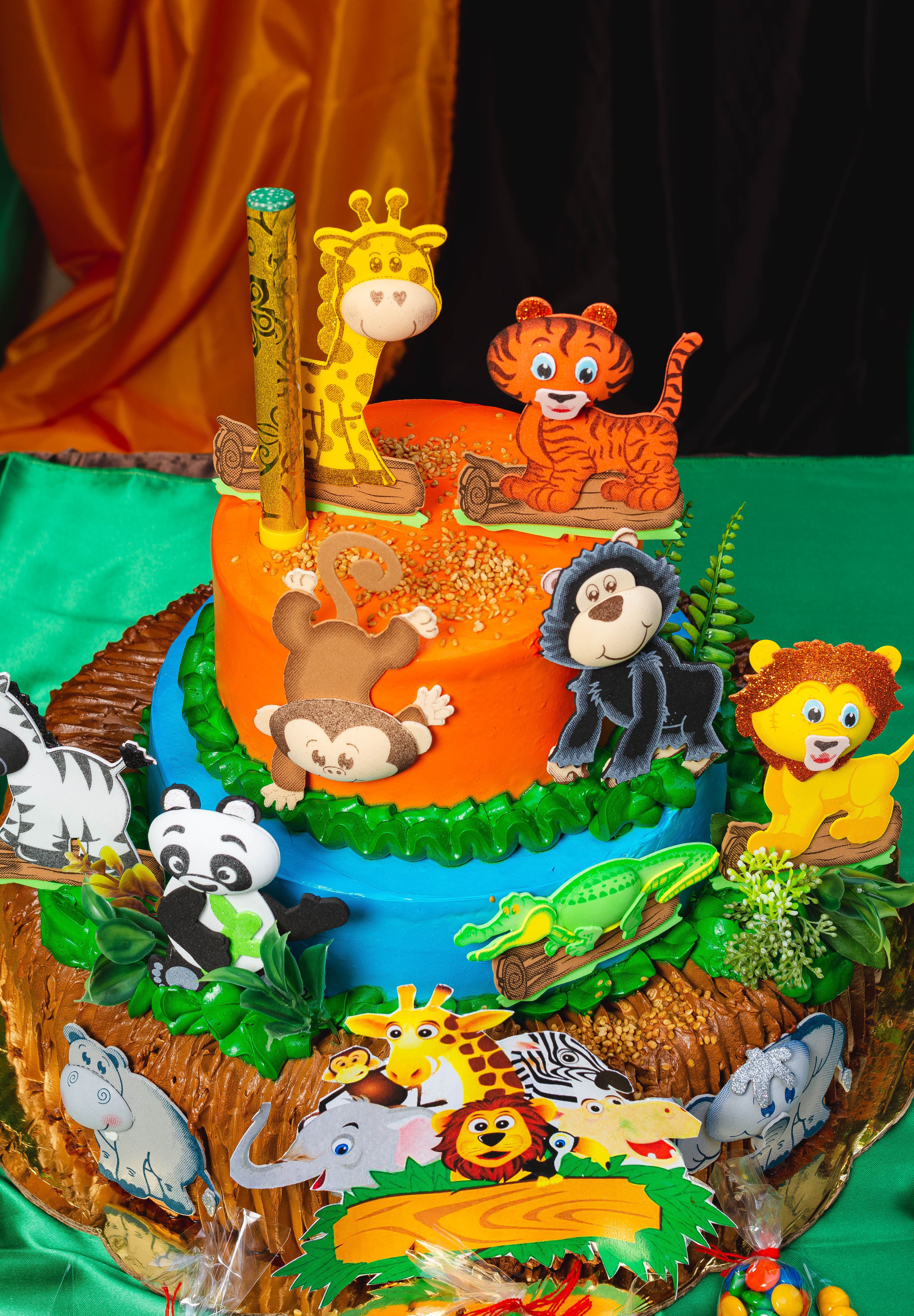 Safari party guests enjoying outdoor celebration with animal decor