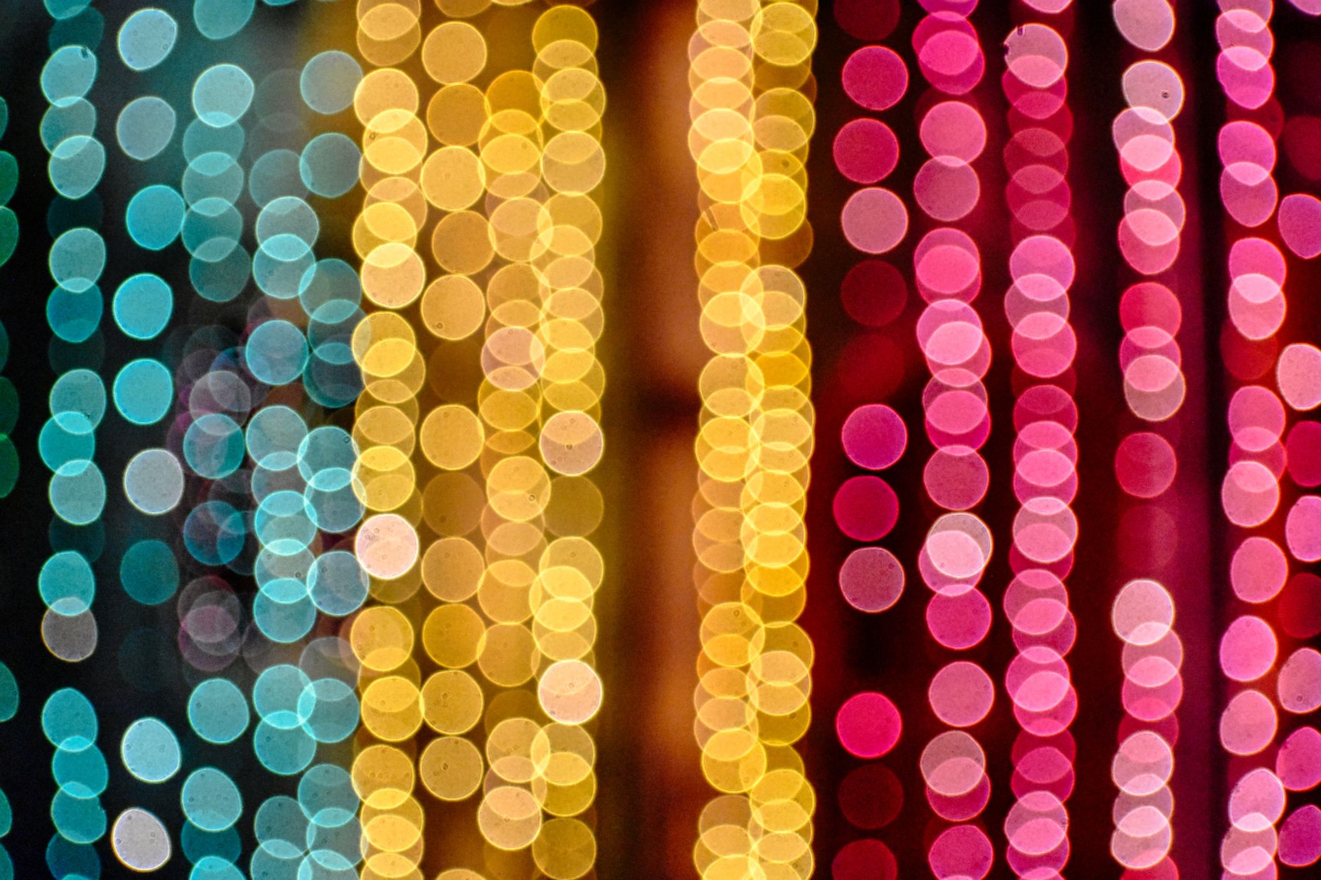Vibrant bokeh lights in various colors create an abstract and festive background.