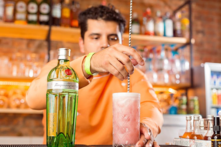 A Man Mixing A Cocktail Drink