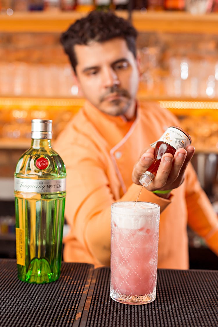 Bartender Making Cocktail At Bar