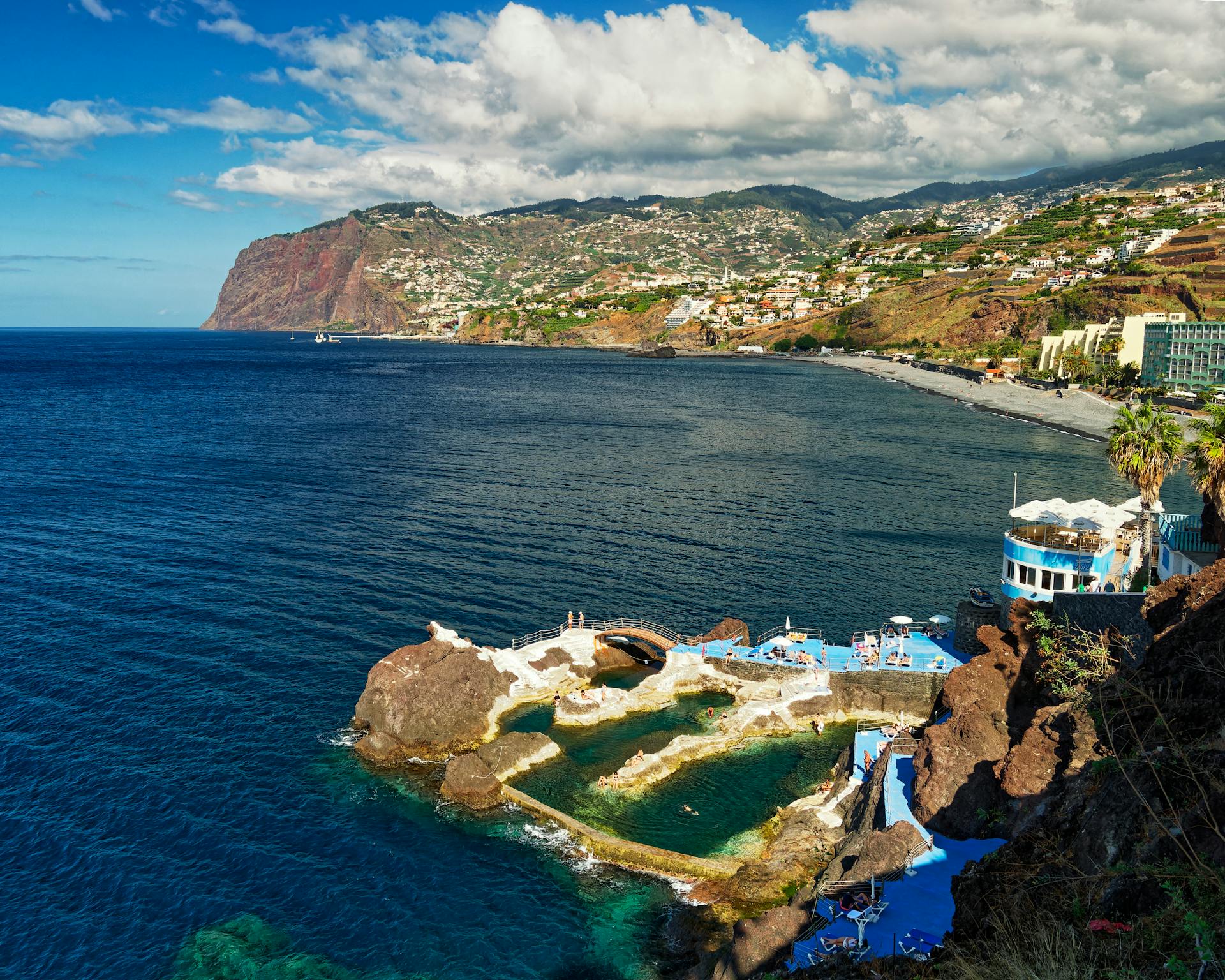 Beautiful coastal shot of Madeira Island with a stunning view of blue waters and hills, perfect for travel inspiration.