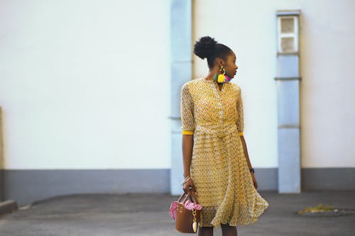 Woman Doing Pose Wearing Yellow Dress