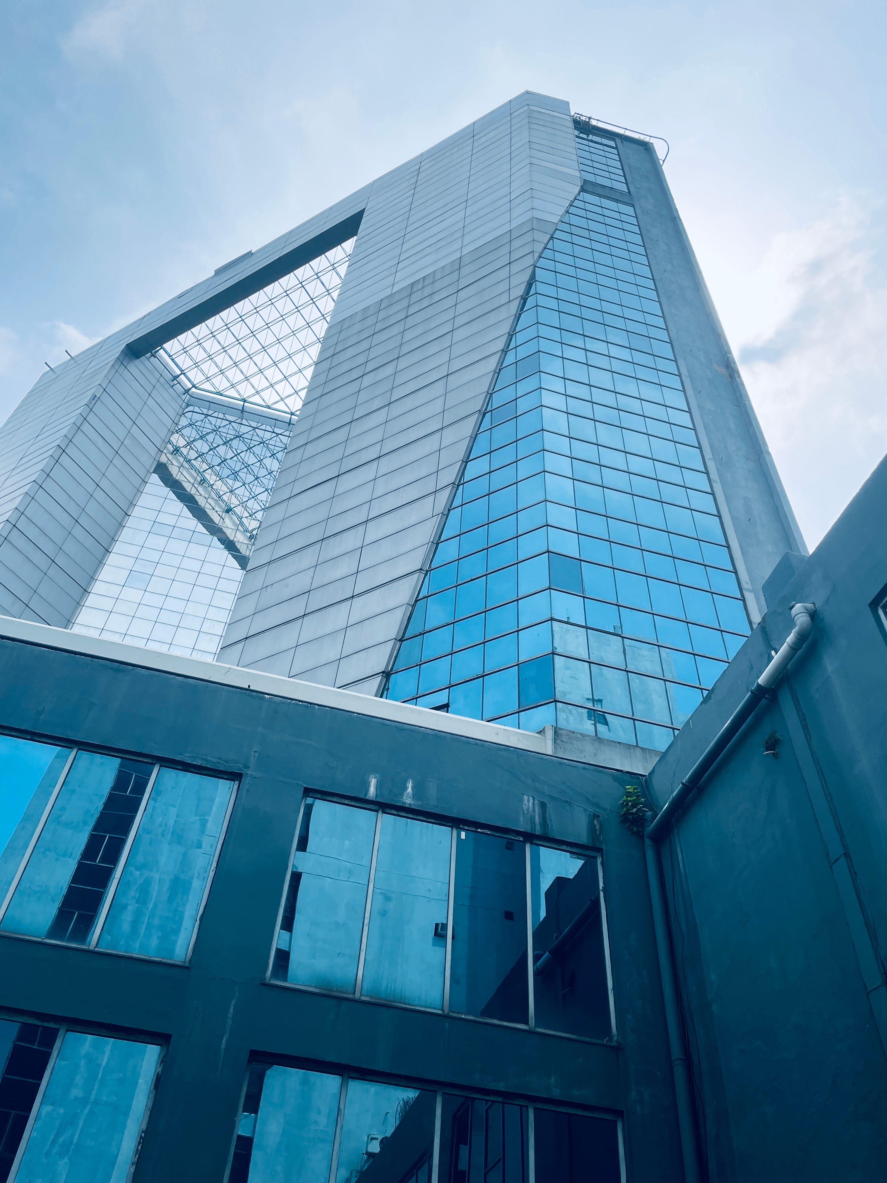 Blue Glass Facade Building under Blue Sky · Free Stock Photo