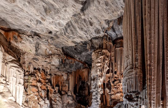 Explore the breathtaking formations of stalactites and stalagmites in this ancient cave's interior.