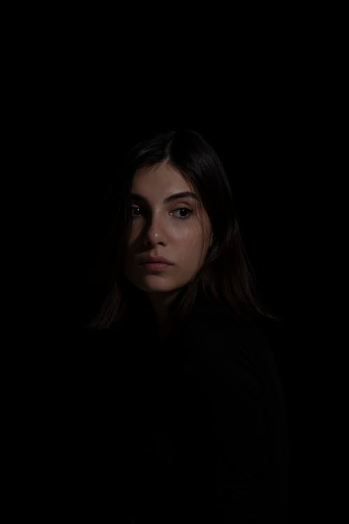 Portrait of a Woman in a Dark Room 