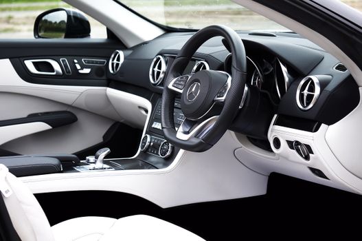 Explore the sleek and luxurious interior of a modern Mercedes sports car.