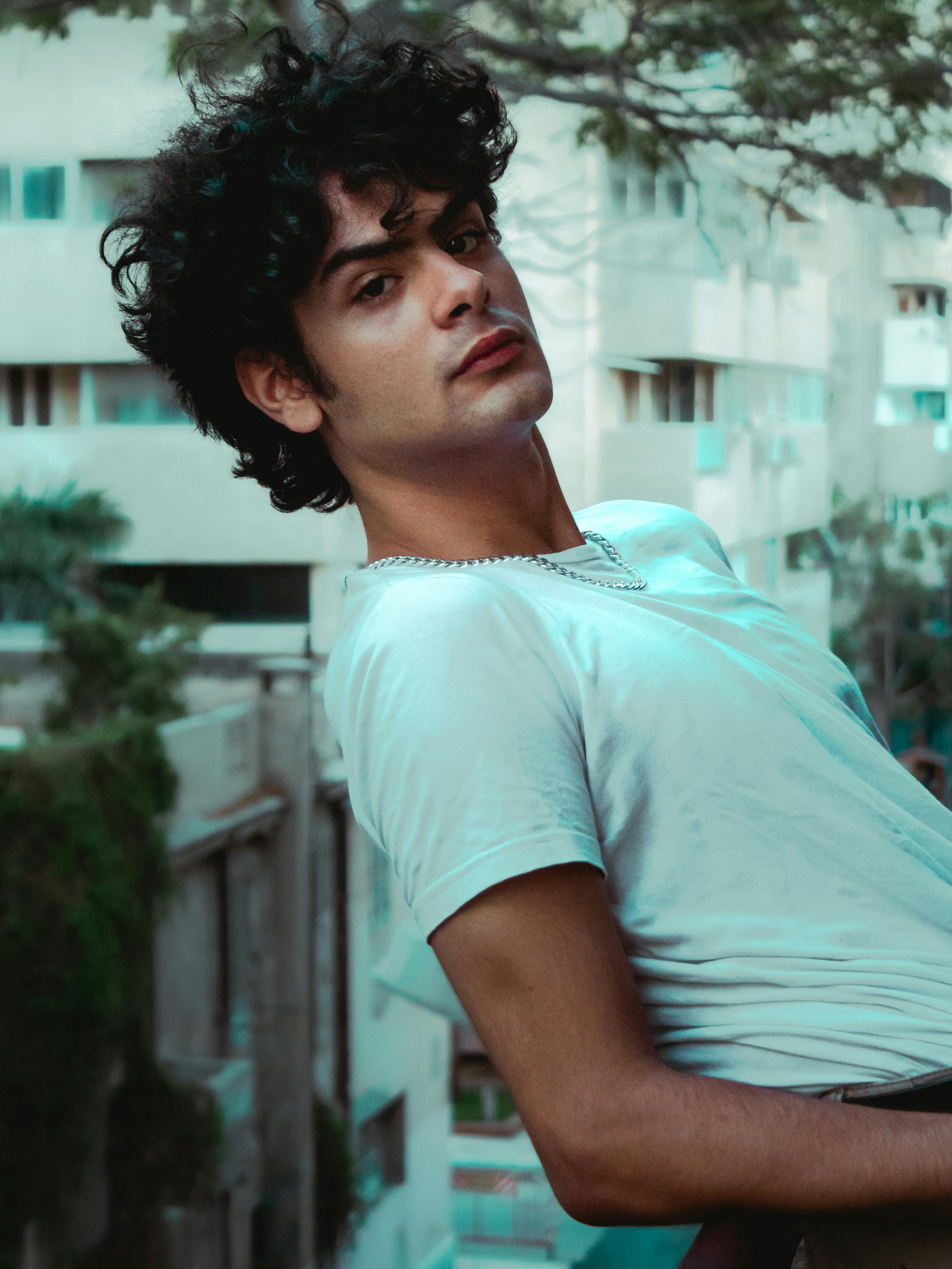 Portrait of a stylish young man posing outdoors in Alexandria, Egypt.