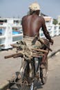 African Man Riding on Bike