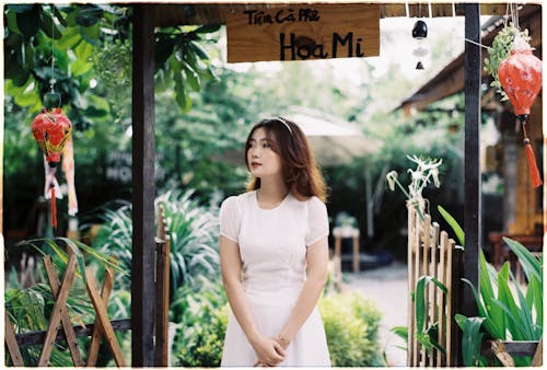 Asian Woman in a Tropical Garden