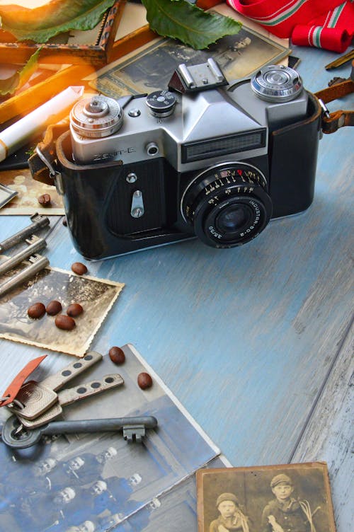 Black Film Camera on Blue Wooden Surface