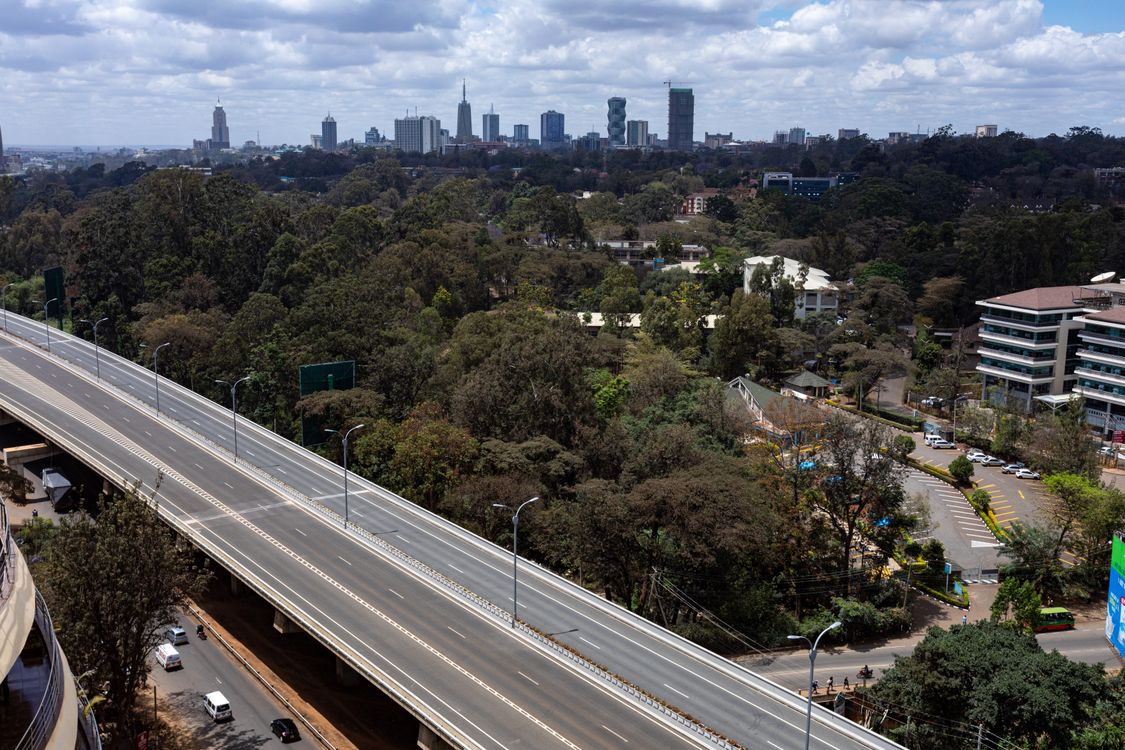 Highway and City Buildings ยท Free Stock Photo