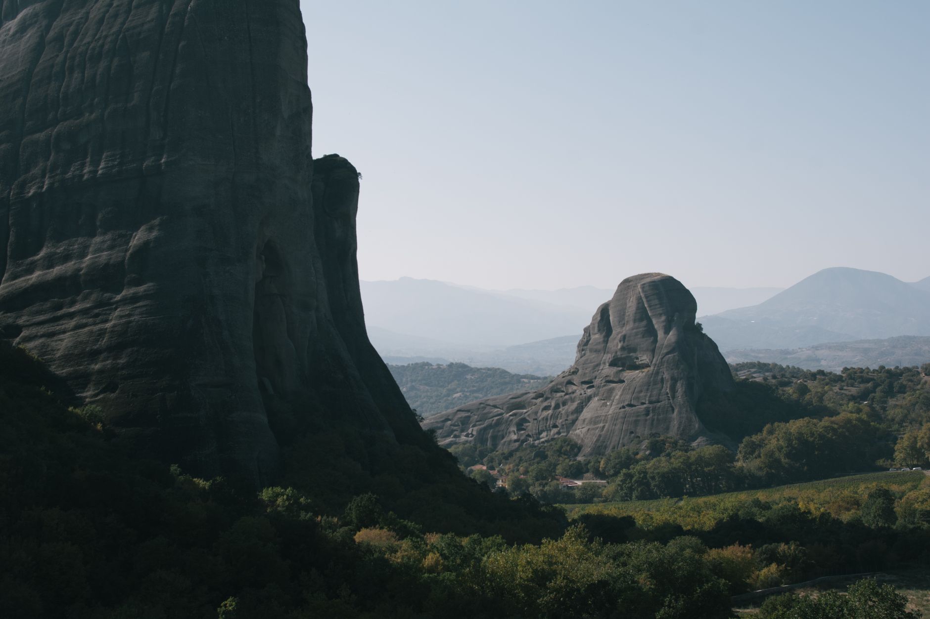 15 Hidden Travel Gems Unexplored Around the World 12 Rock Mountain Surrounded with Green Landscape