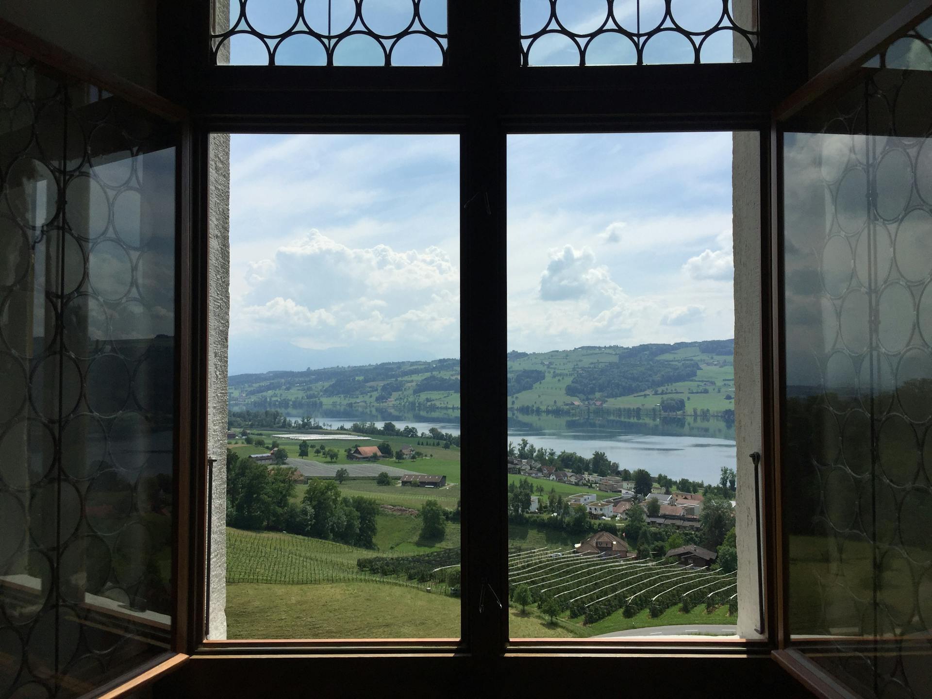 Breathtaking landscape of Swiss countryside seen through a window in Sachseln, Obwalden.